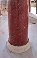 Base of red scagliola column 