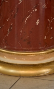 Gilded base of red scagliola column 