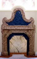 Fireplace with scagliola surface